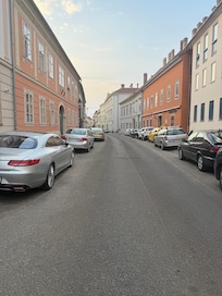 Hotel street scene right in front of hotel and one way car path