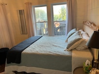 Back bedroom with view of back enclosure