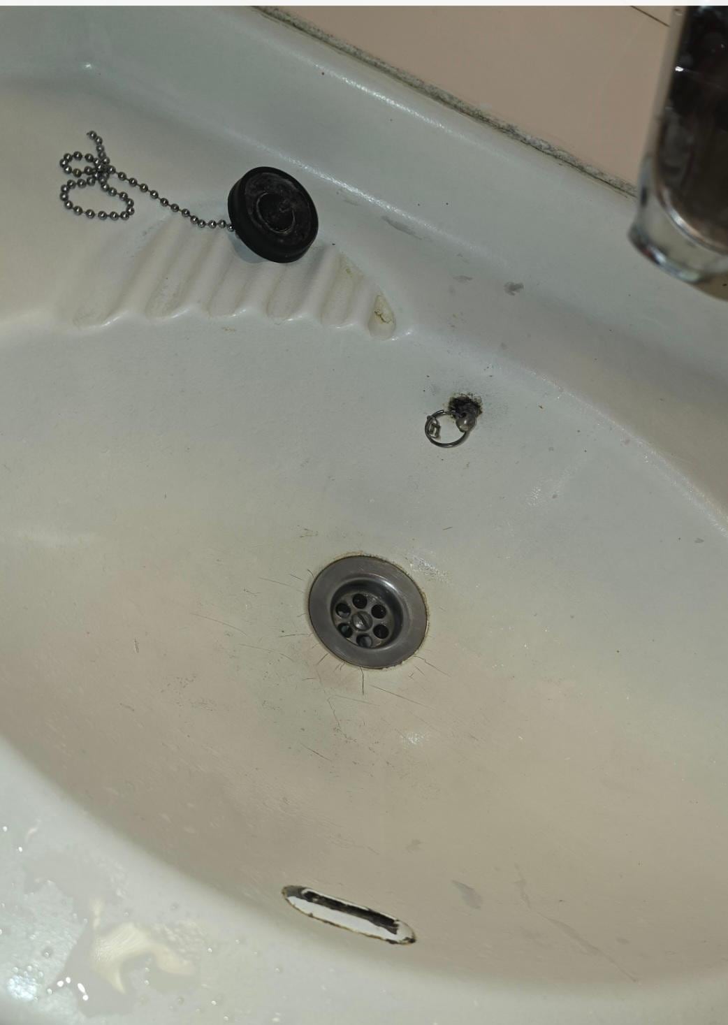 Broken sink damp all around outside dirty