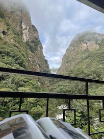 My morning coffee view from my room patio, with Machu Picchu guidebook in hand