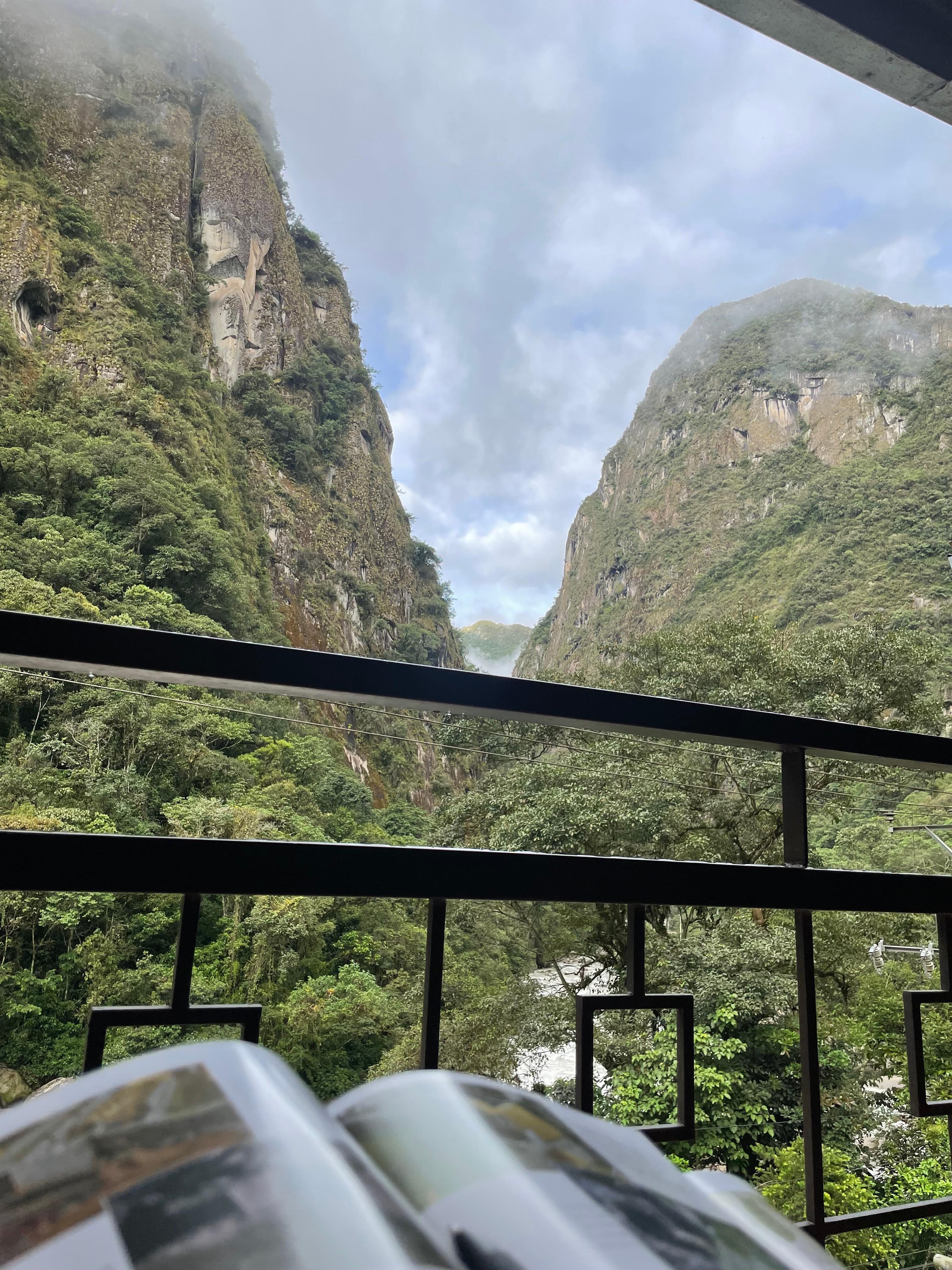 My morning coffee view from my room patio, with Machu Picchu guidebook in hand