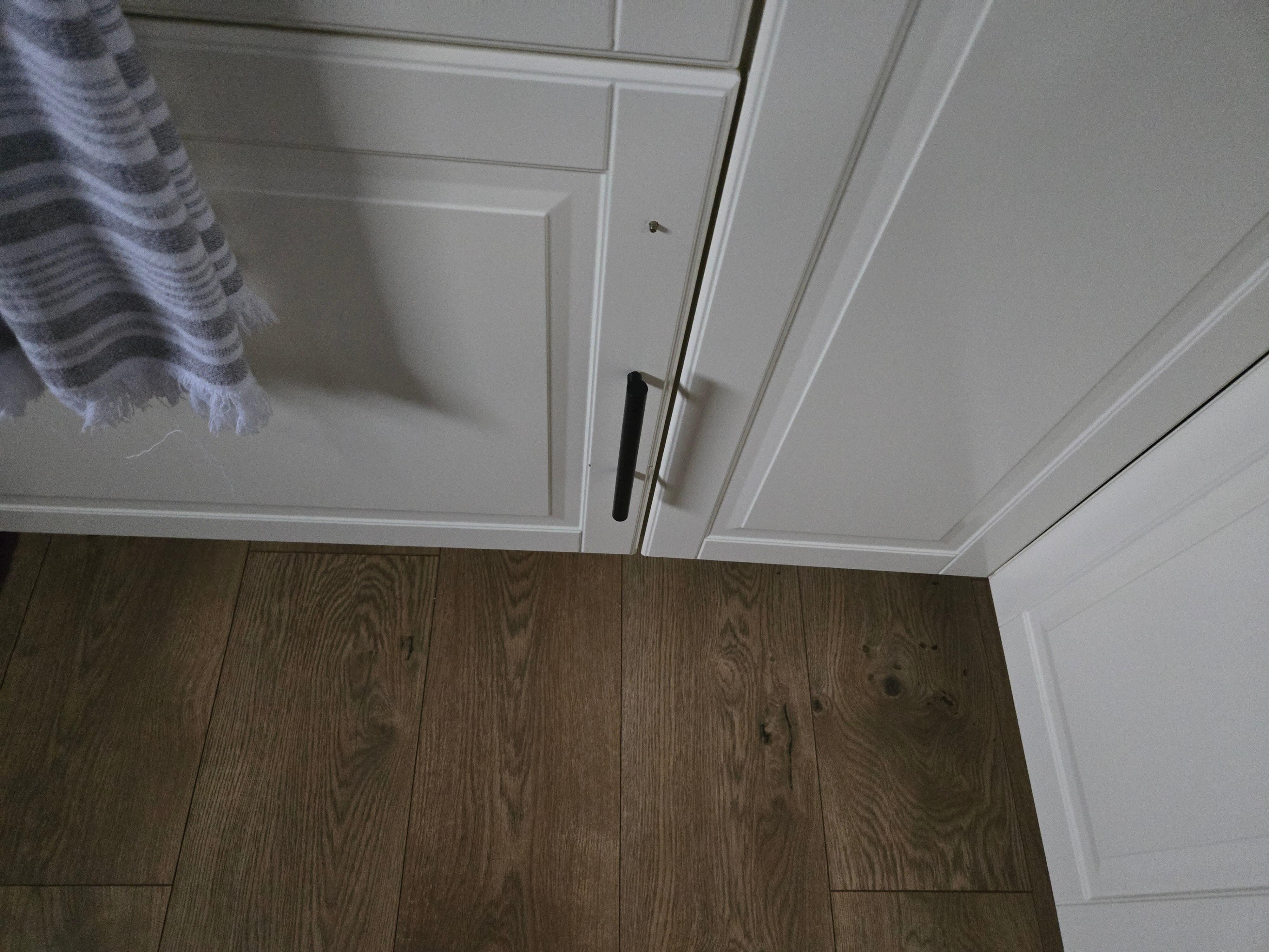 Handle on kitchen cabinet falling off.