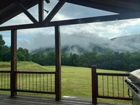 View of back of the property. Loved seeing this sight often! Spacious back deck, pond, and beauty everywhere!