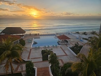 Sunrise right over the pool and balcony