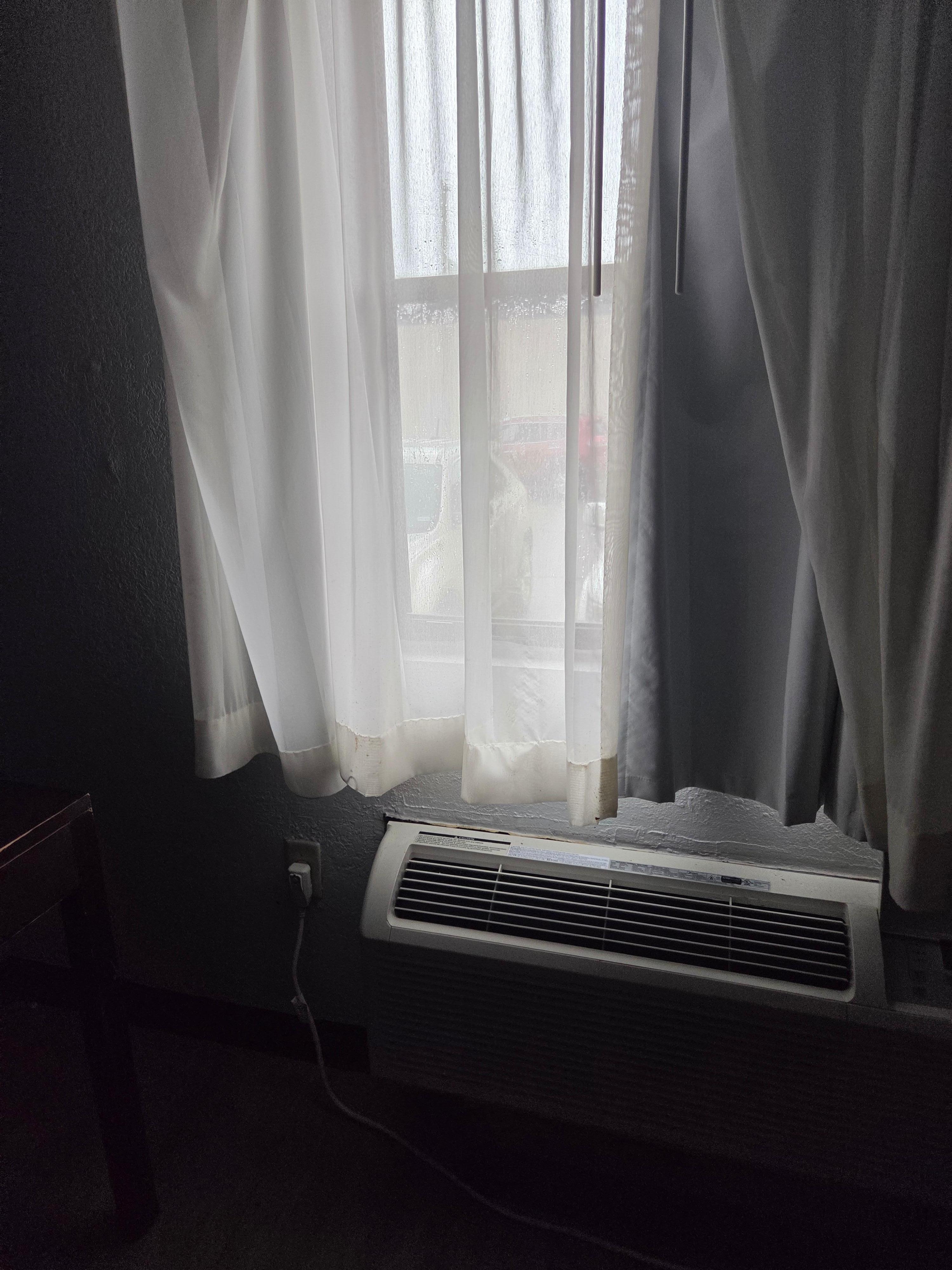 Curtains that were broke so the window was like this all night