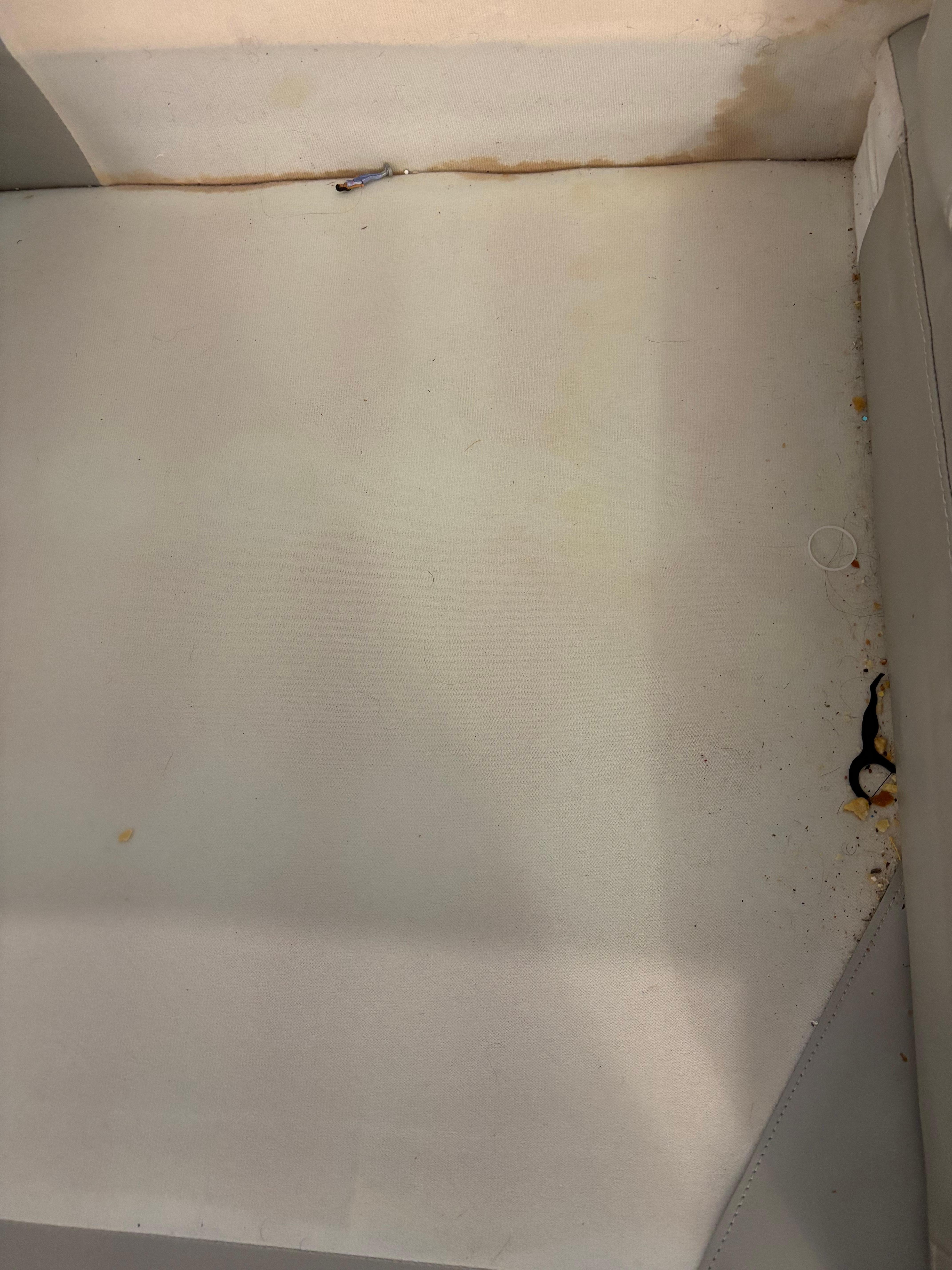 Under one couch cushion 