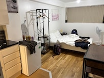 Far cry from the bright airy room pictured