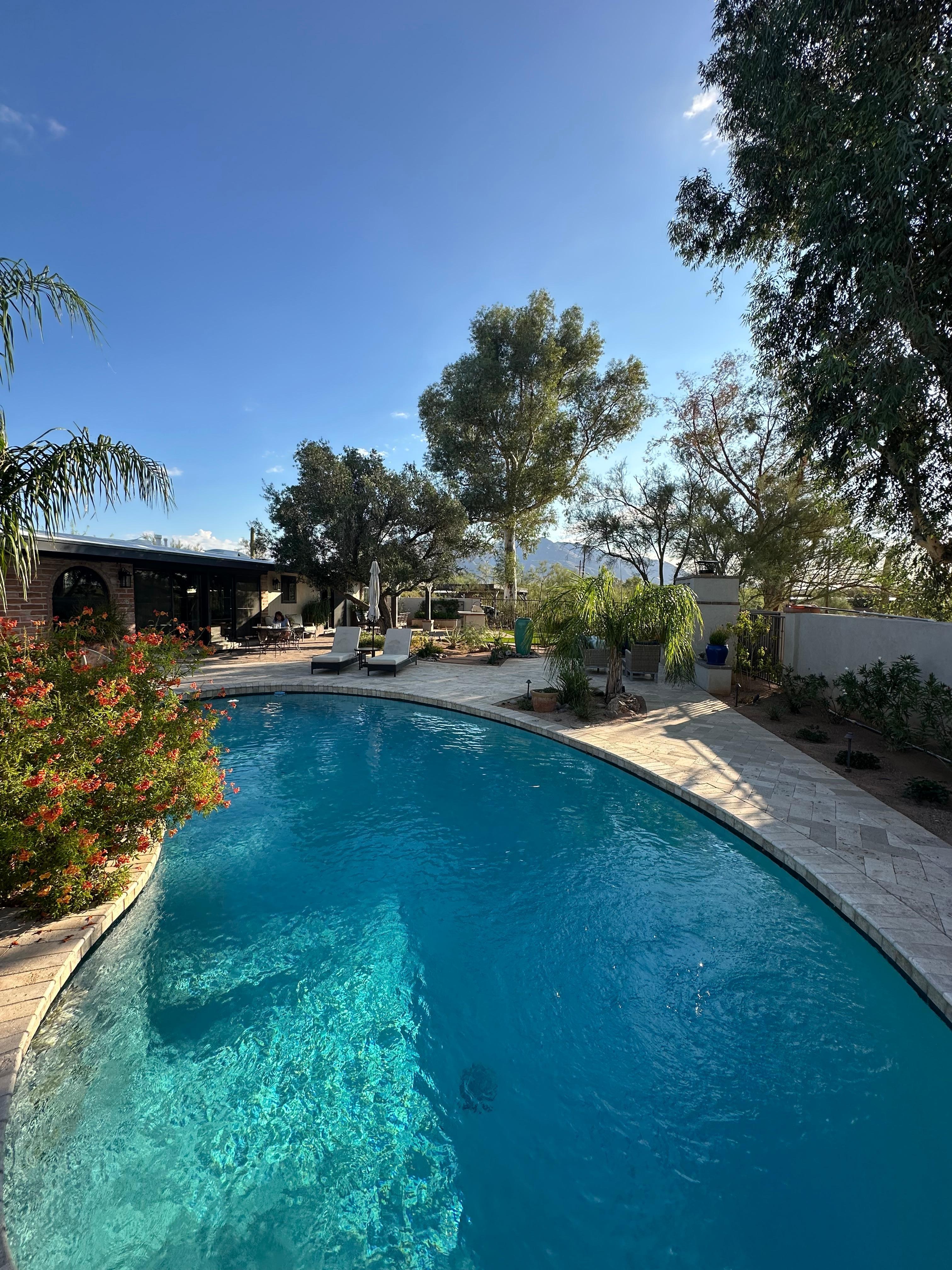 Pool with house in background.