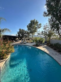 Pool with house in background.