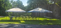 Set up for family picnic in large yard next to the bocce court.
