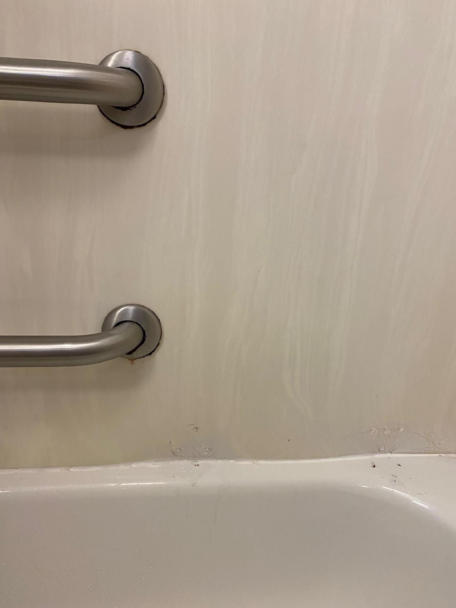 Black gunk and dirty tiles.