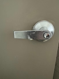 Caulk under & behind bathroom door handle