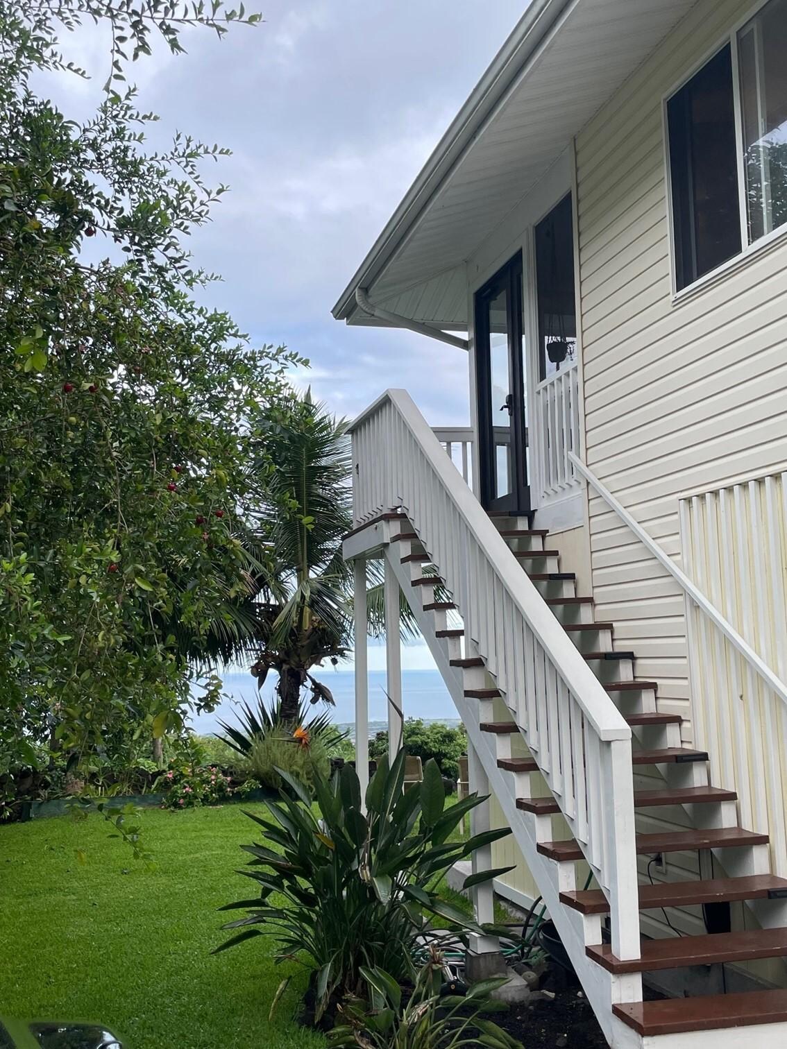 A part of the yard and the steps up