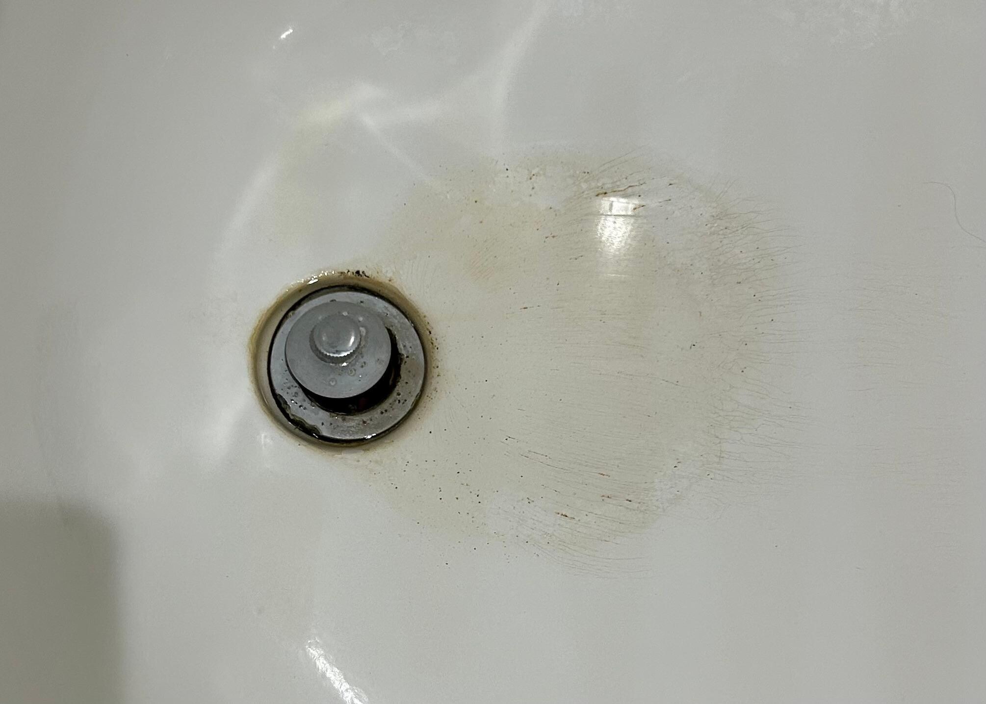 Stains and grime around drain