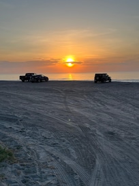 Sunrise at beach across from hotel.
