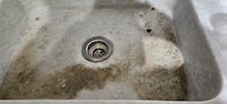 Rubble in sink from ceiling