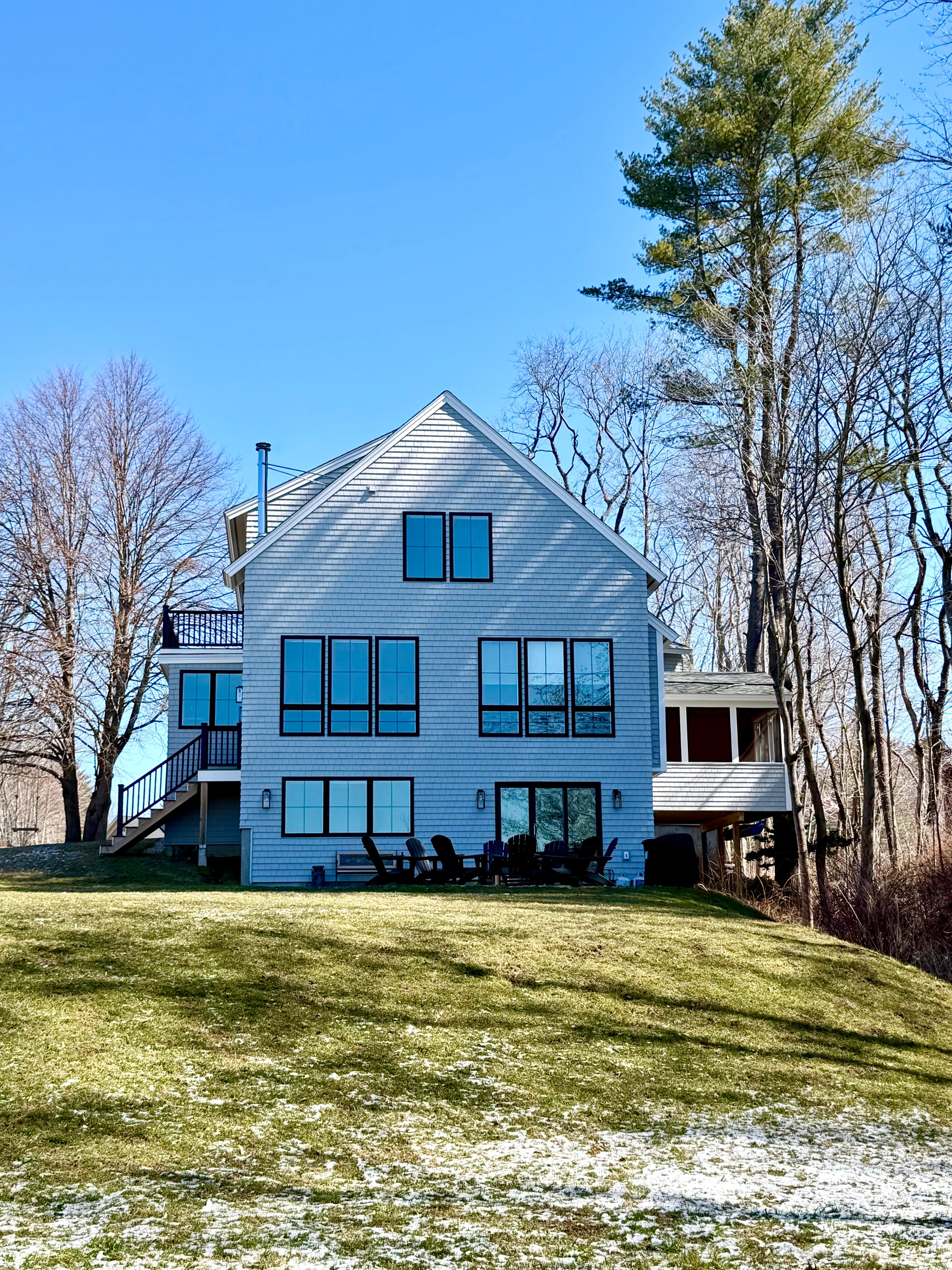 View of the house from the sweeping lawn down to the Saco River.