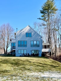 View of the house from the sweeping lawn down to the Saco River.