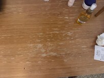 The little credenza where the fridge is. Scratched up and just messy.