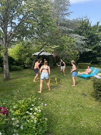 Playing spikeball in the garden