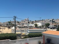 View from the covered patio of the area with restaurants