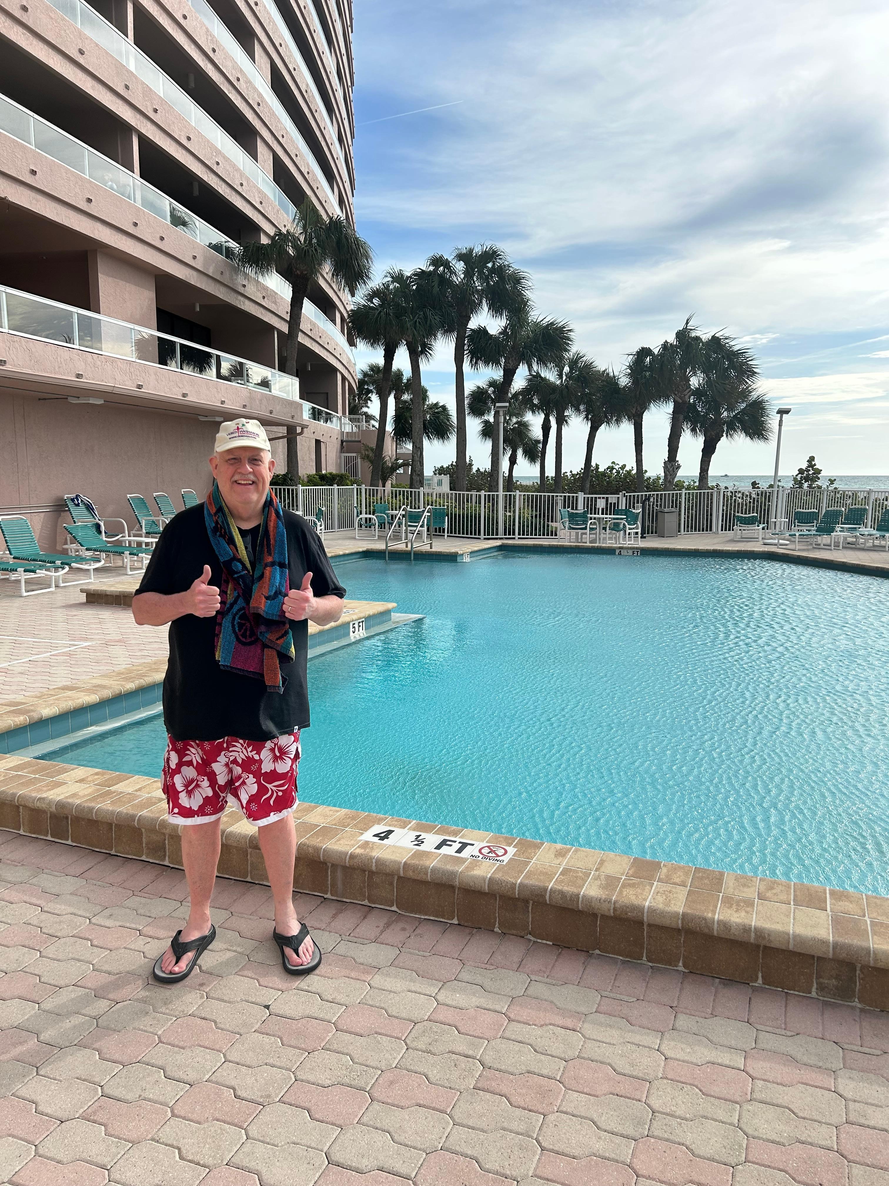 My father enjoying the pool and hot tub area.