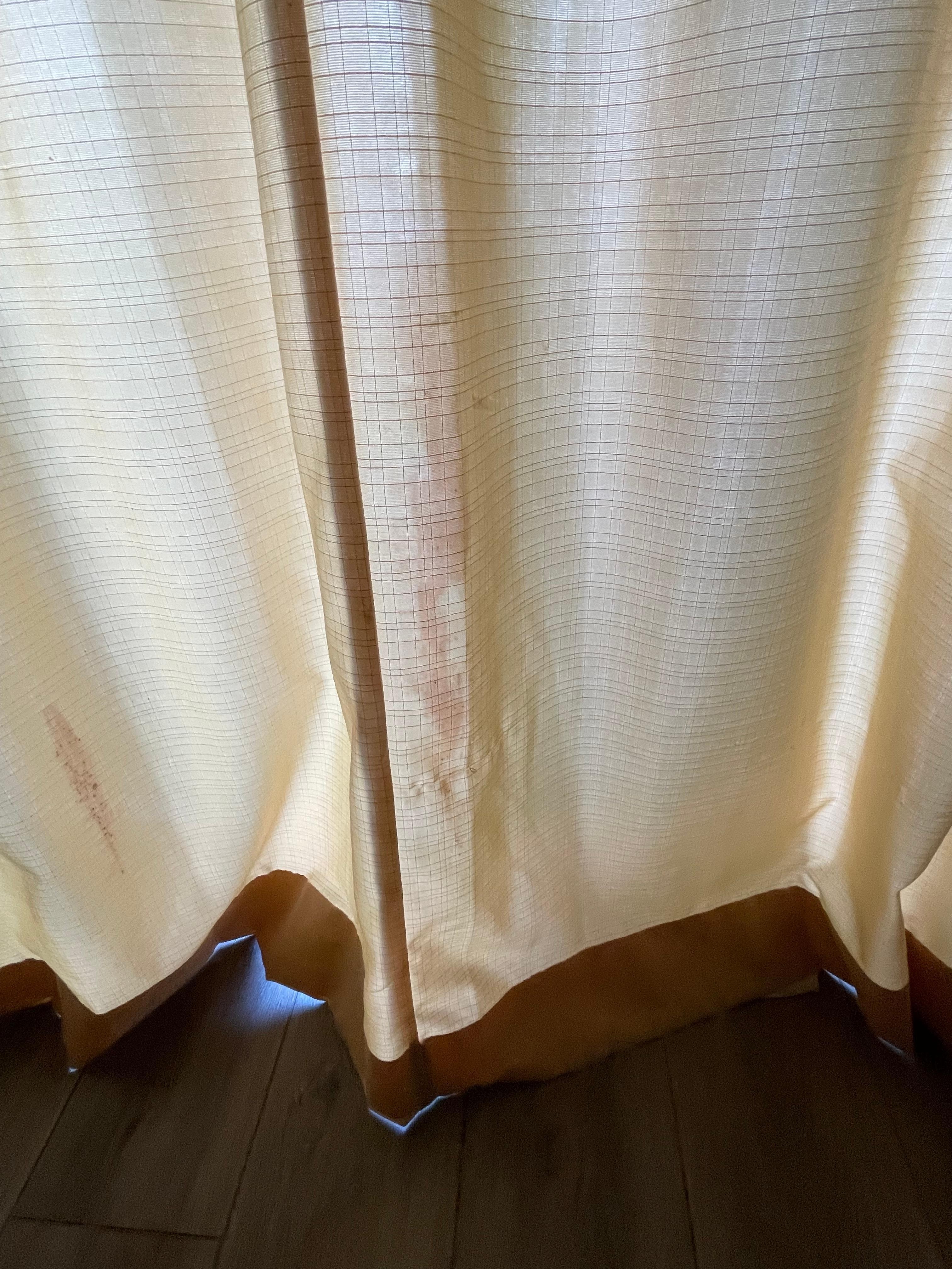 Dirty stained curtains.