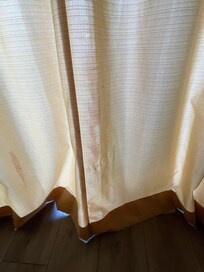 Dirty stained curtains.
