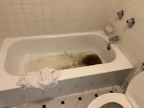 Old room dirty bath tub with dirty towel