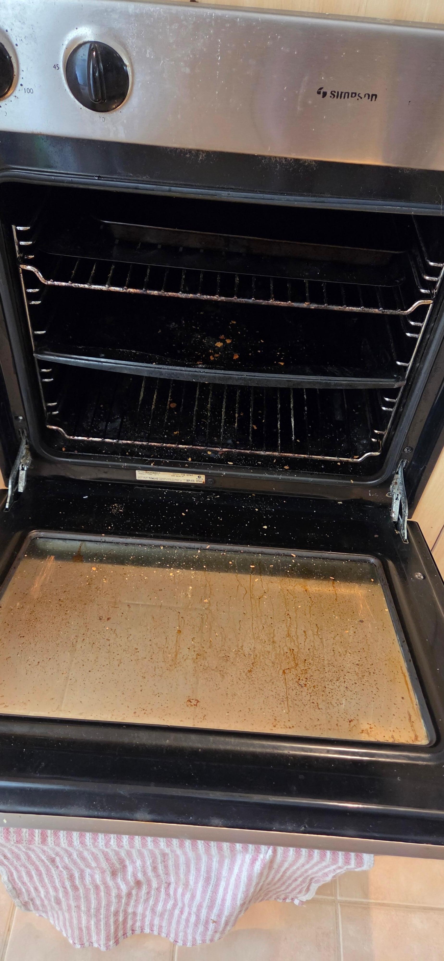 Oven full of crumbs and build up