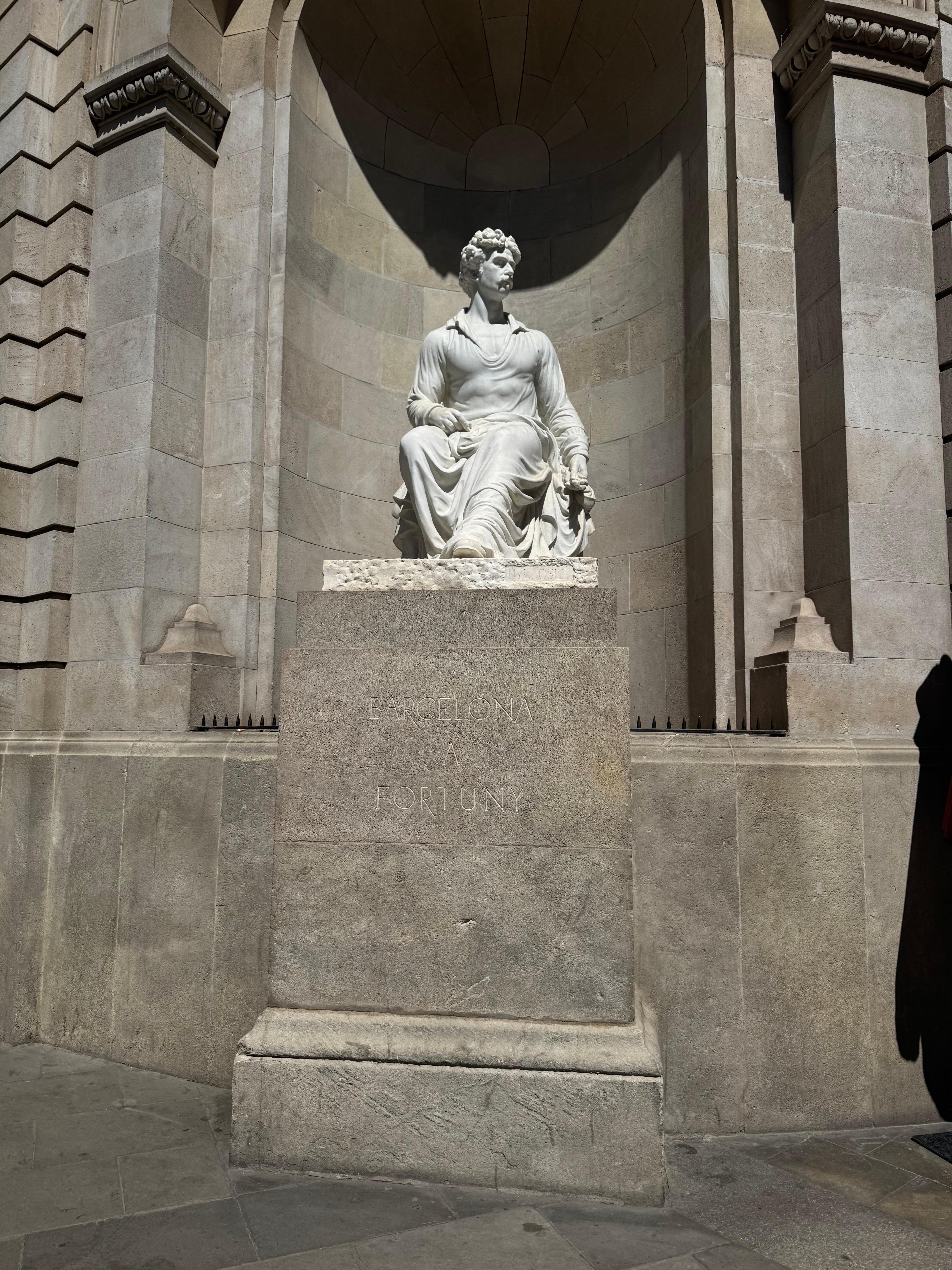 A statue on the backside of the hotel