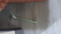 Nasty straw under the couch. Too scared to move the couch to see what else was back there.