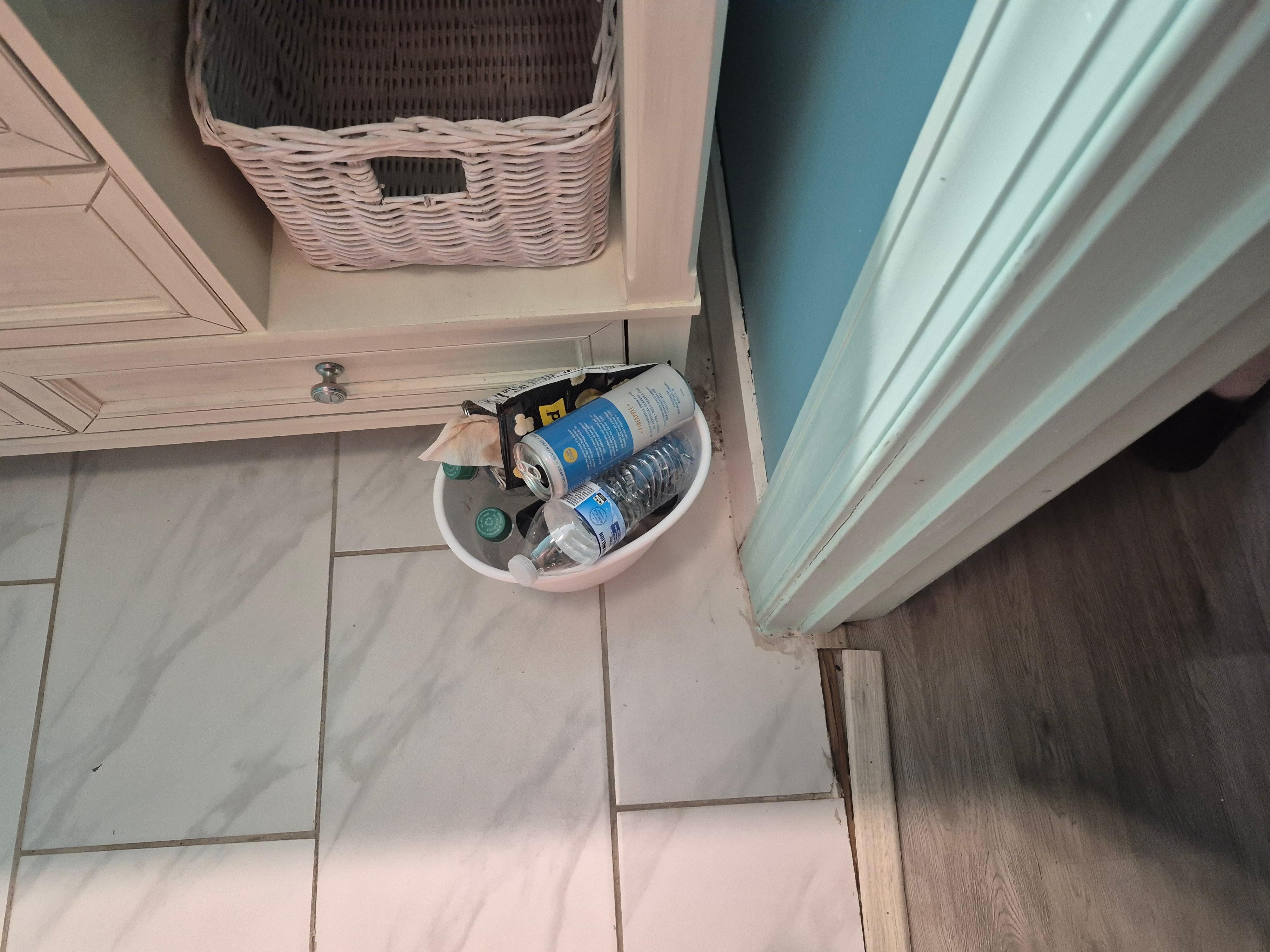 Garbage in bathrooms and broken door trim/transition.