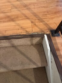Broken threshold stained carpet