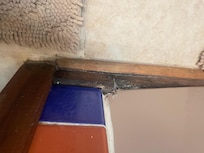 Tub repair attempt with wood and silicone putty