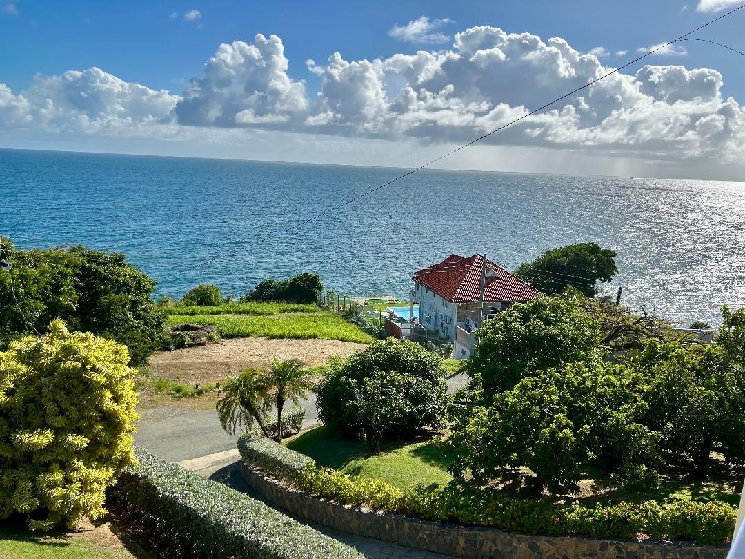 The villa is located at the end of this road overlooking another villa below