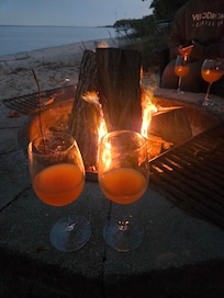 Drinks by a warm fire on a fall night.