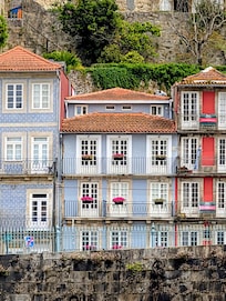 I took this picture from a boat while on a river cruise. The center building with the flowers is the Miragaia Riverside Suites.