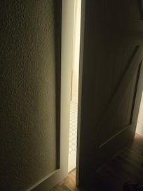 Bathroom door offered no privacy or noise barrier