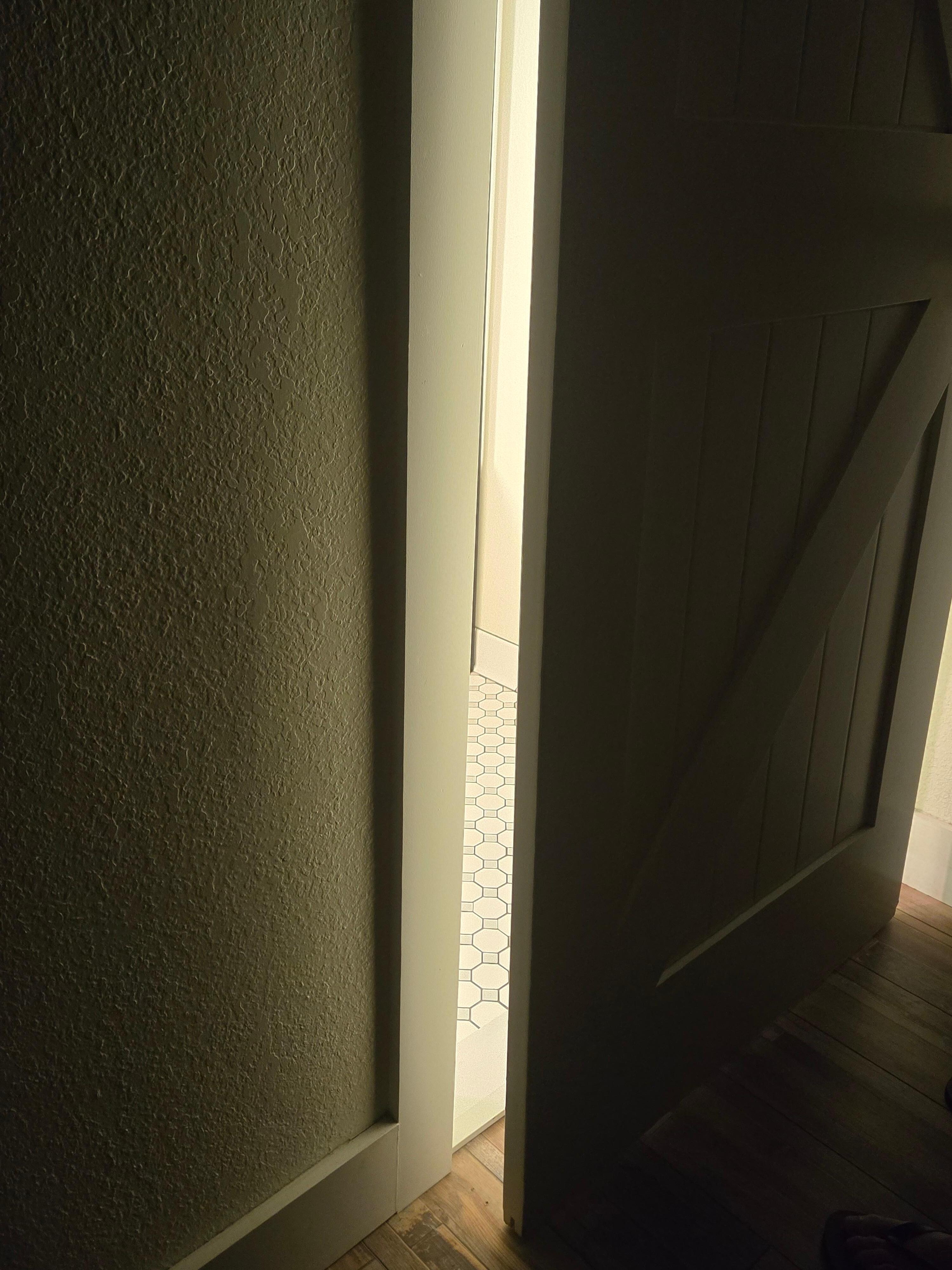 Bathroom door offered no privacy or noise barrier