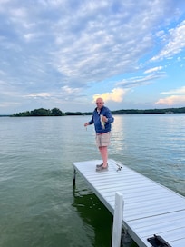 Husband catching bass off the pier.
