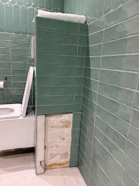 Bathroom needs tile repairs.