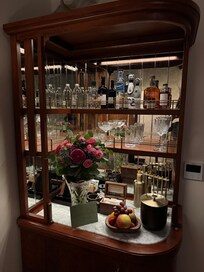 Hutch and beautiful glassware in the room