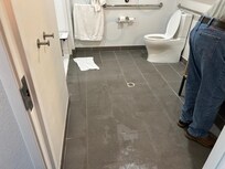 Water covering the bathroom floor