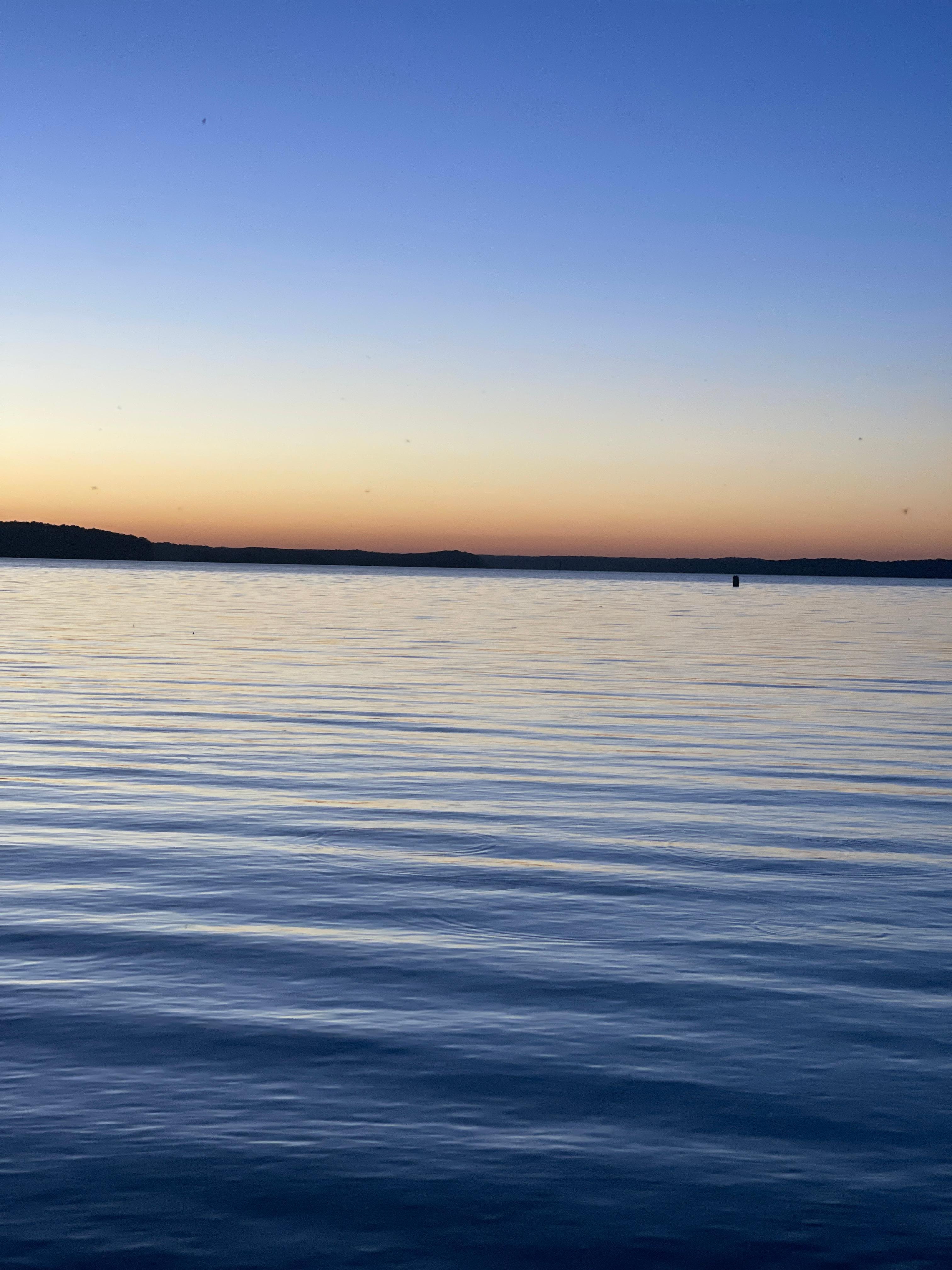 Sitting on the bank at sunset.