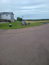 Outside of room, play structure and excercise equipment
