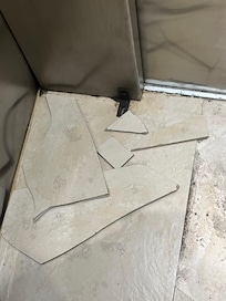 Tiles in the elevator came up and I almost fell over them