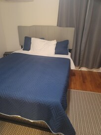 One pillow (unless you want to use decorative pillows that may or may not have been washed after use. Bed frame is flimsy, mattress very minimal