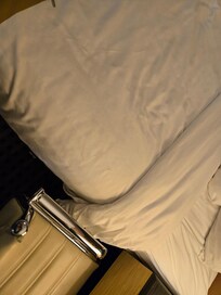 It looked like somebody sit on the bed.