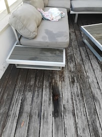 More large holes in the decking at the seating area